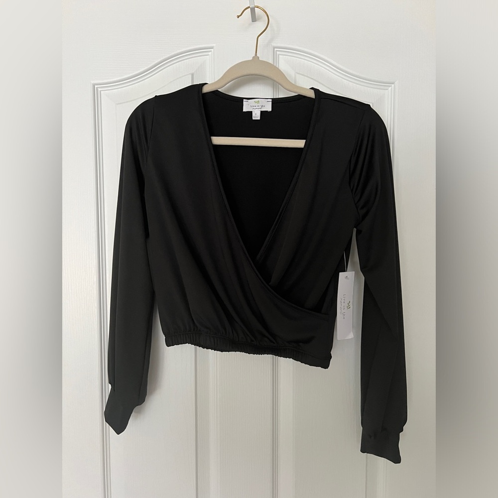 Versatile black long sleeve crop top! Easy to dress up or down.